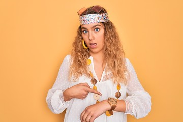 Young beautiful blonde hippie woman with blue eyes wearing sunglasses and accessories In hurry...