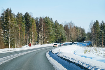Obraz premium Car at a road at snowy winter Lapland