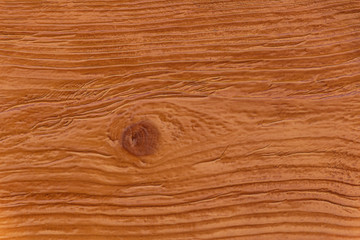 Naklejka premium close up of brown lacquered wooden board