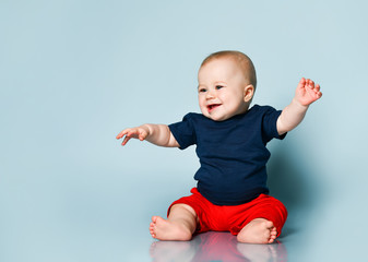 kid boy laughing on blue background