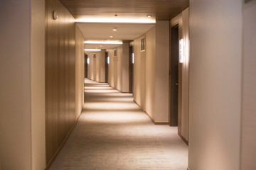 long corridor in a hotel - obrazy, fototapety, plakaty