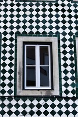 Typical vintage portuguese facade with old window