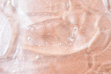 Transparent cosmetic antibacterial gel close-up. The concept of cleanliness. Antiseptic. Mother of...