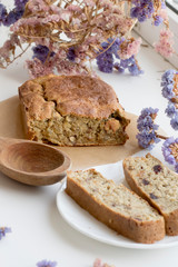 healthy homemade sugar pie on white background with flowers. Pie with raisins and nuts