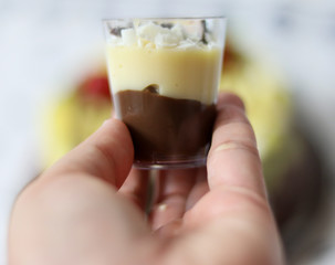 The brigadeiro with branquinho in the cup is a typical sweet of Brazilian cuisine, common in...