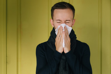 Ill upset man, blowing running nose, got fever, caught cold, sne