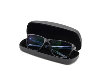 Stylish black glasses with blue tinted lens with black glasses case box isolated on white...
