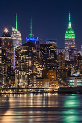 Photo of the empire state building in its saint patricks day colors as seen from NJ