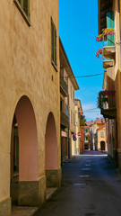 Fototapeta premium Empty Street in the Italian town Fossano in Province Cuneo, Region Piedmont, northern Italy.
