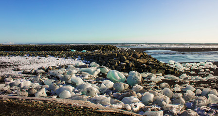 ice fields at the black pebble beach, coast of iceland