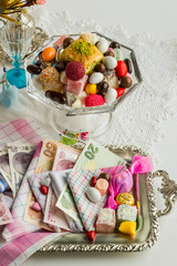 A forgotten tradition,it was given money and candy,delight in fabric handkerchiefs for kids when holidays.Different handkerchiefs was for girls and boys.Top view,of a vintage table.