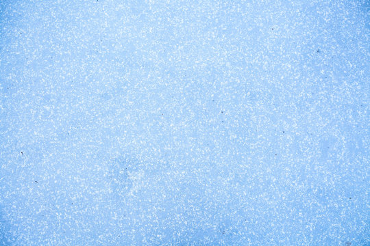 ice background ice on a frozen lake, blue texture