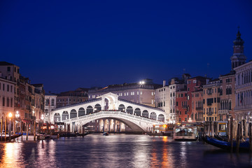 The famous Rialto bridge in Venice, Italy during the night