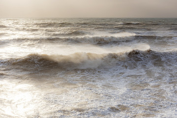 Storm at sea, storm warning on the coast. Thunderclouds and big sea waves during a storm. - image. Storm on the black sea in Crimea