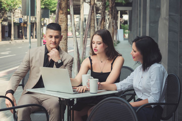 Group of young business people working  outdoors office.Young woman use technology device contact communication business. relax outdoors office 