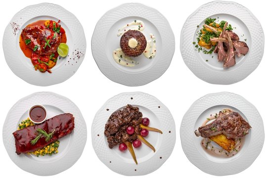 Set Of Meat Dishes: Rack Of Lamb, Steak On The Bone, Duck Leg And Pork Ribs In The Glaze. Isolated On A White Background.