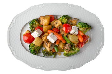 Beef medallions with steamed vegetables. Fitness nutrition. Banquet dishes. Isolated on a white background.