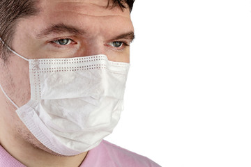 Portrait of adult caucasian man who wears protective mask on his face against influenza and protect health from bacteria.