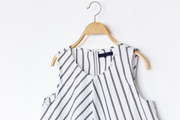 blouse is on clothes-hanger on white background.close up.