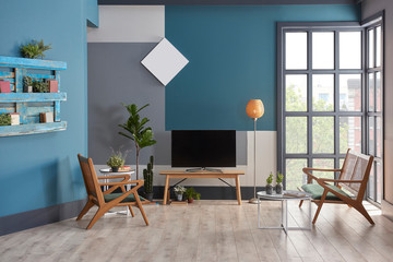 Decorative living room blue grey and white wall concept with black window. Wooden chair and furniture decor. lamp clock and carpet design.