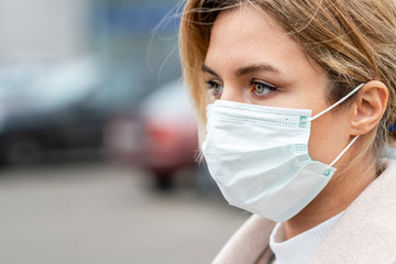 Portrait of young woman wearing surgical mask