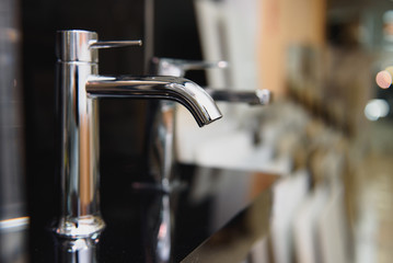 Water faucet, bathroom faucet and kitchen faucet. Chrome-plated metal.
