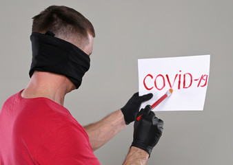 Healthcare and medical concept. Man in medical face mask and gloves  holding banner with the...