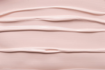 Texture of liquid foundation cream background close up