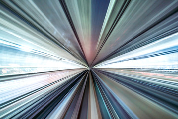 Motion blur of train moving inside tunnel with daylight in tokyo, Japan.