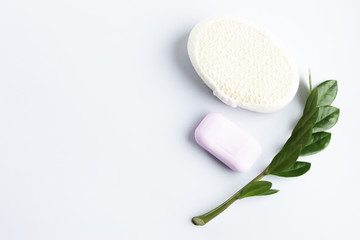 washcloth, soap and shampoo on a white background