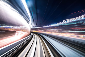 Fototapeta na wymiar Motion blur of train moving inside tunnel with daylight in tokyo, Japan.
