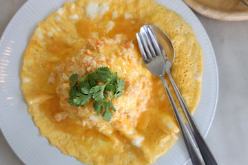 Close up Shrimp Omelette Served on steamed rice In a white circular dish Looks delicious