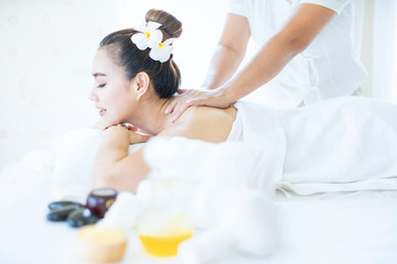 Obraz na płótnie Canvas Female in spa. Young and healthy female in spa. Asian woman in wellness beauty spa having aroma therapy massage with essential oil. Thailand.