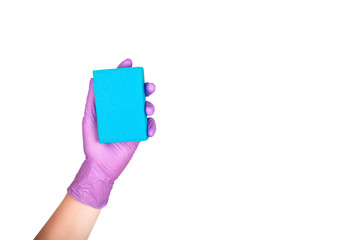 Hand in a glove holds a sponge for washing and cleaning dishes