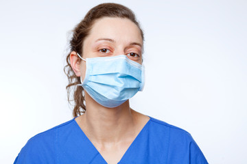 close up portrait of young nurse with mouthpiece mouth protection surgical face mask medical...