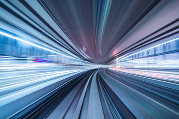 Fototapeta na wymiar Motion blur of train moving inside tunnel with daylight in tokyo, Japan.
