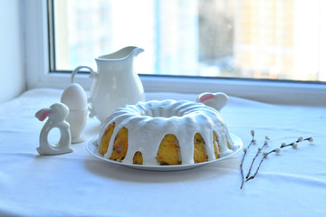 Festive Easter spring composition with pussy willow branches with catkins and multicolored eggs.Easter Background. Springtime. Invitation card design with copy space. Easter card template.