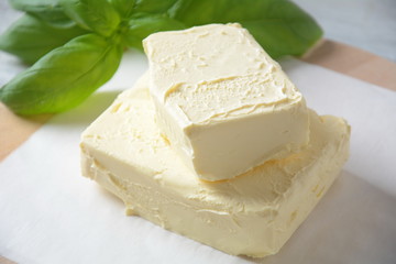 Butter. Slice of butter with basil