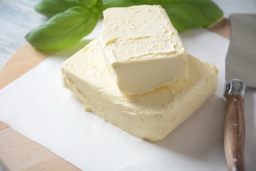 Butter. Slice of butter with basil