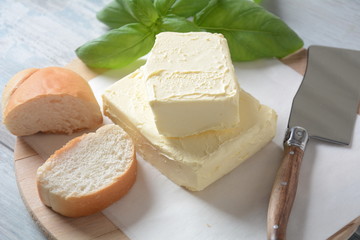 Butter. Slice of butter with basil