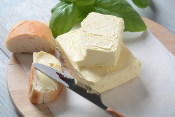 Butter. Slice of butter with basil