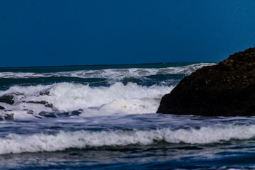 Fototapeta na wymiar Pounding surf rolling into Bethels Beach. Auckland, New Zealand