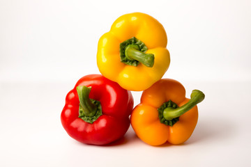 colorful bell peppers isolated on white background