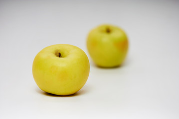 still life of two apples on white background