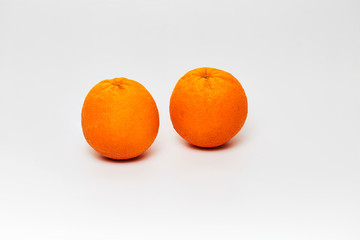 still life of oranges on white background