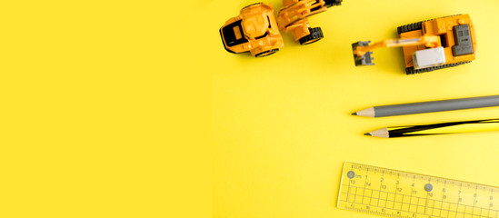miniature of construction equipment and vehicle toy cars  flat layout view on yellow background.Banner  ratio © ftgstudio