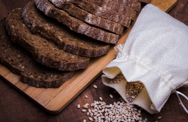 bag of grain with farm whole grain bread with nuts and fruit added, on the Board