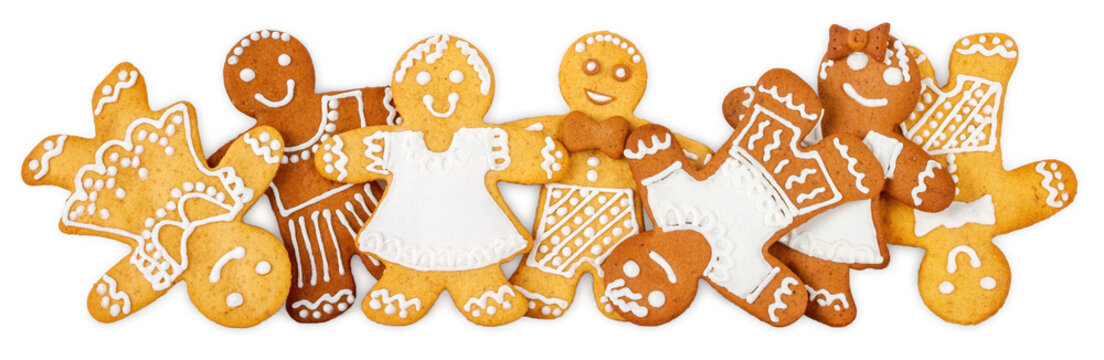 Christmas border, banner or gingerbread men ornament - homemade sweet cookies in the form of cheerful girls and boys isolated on a white background