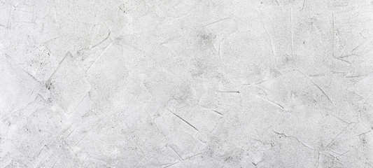 Abstract concrete background, panorama, banner - in the form of a rough covered with folds wall,...