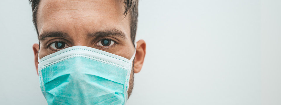 Isolated man doctor wearing medical mask. Coronavirus concept